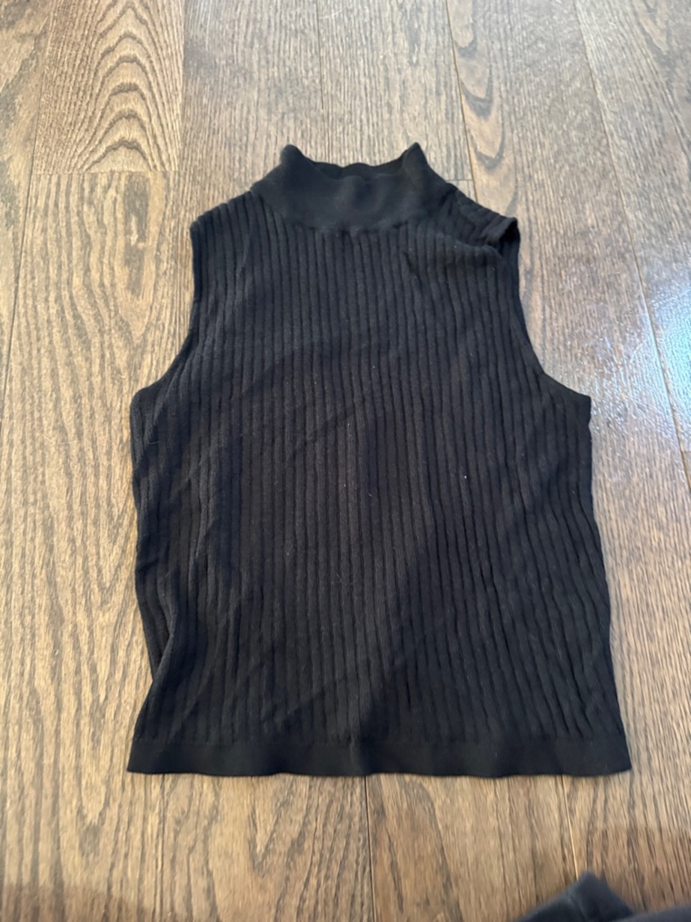 Black sleeveless turtleneck top